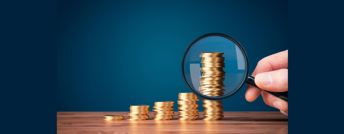 magnifying glass on coins