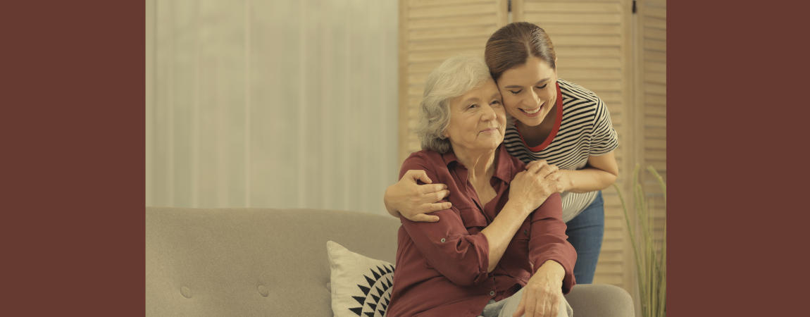 daughter hugging older mom