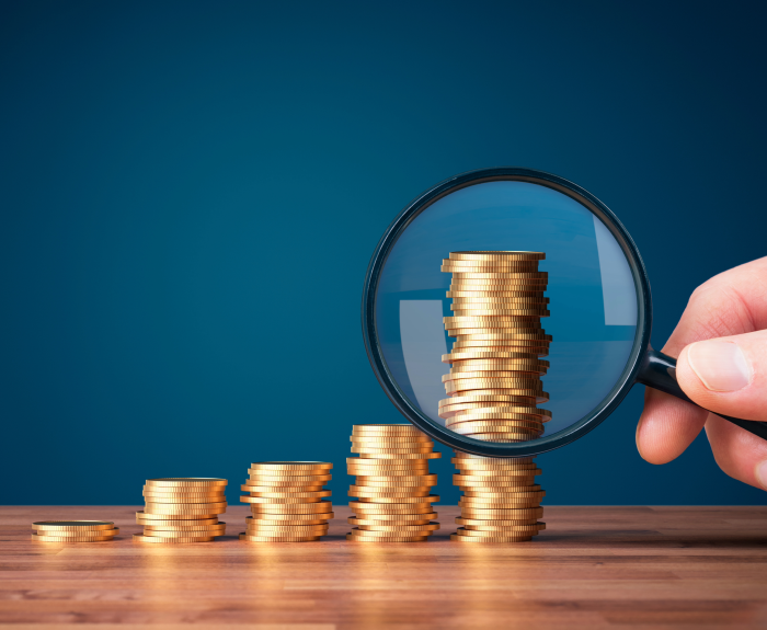 magnifying glass on coins