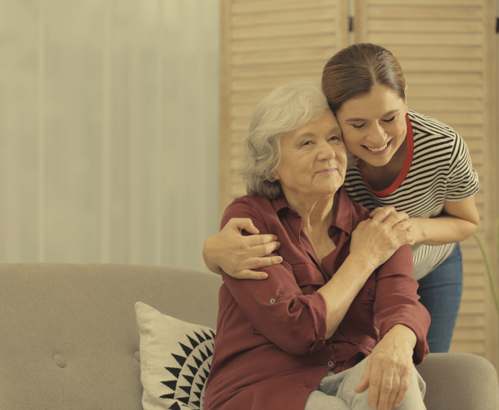daughter hugging older mom
