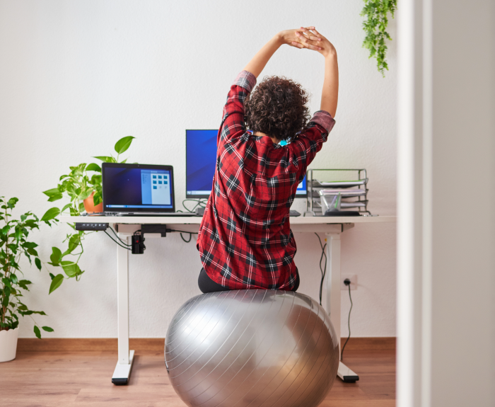 woman exercising at her desk